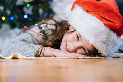 Portrait of young man sleeping on floor at home