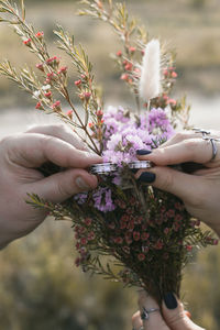 Close up wedding rings and flowers concept photo