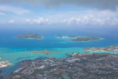 Aerial view of sea against cloudy sky