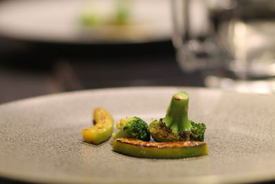 Close-up of broccoli and avocado in plate on table