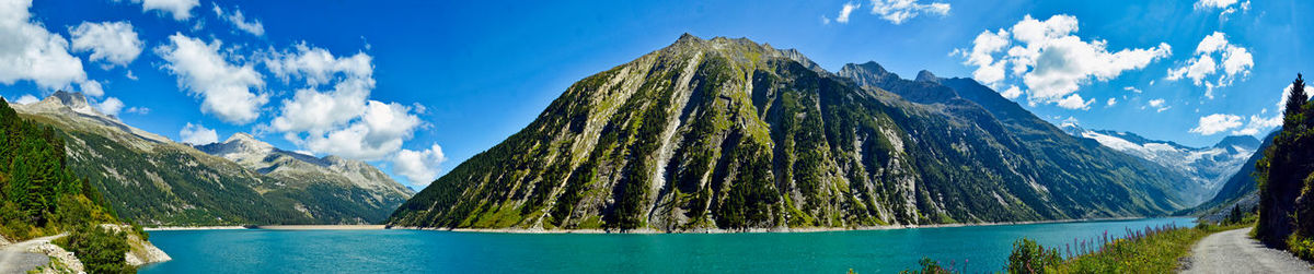 Panoramic view of lake amidst mountains against sky