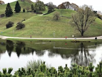 Scenic view of green landscape against sky