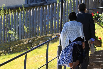 View of woman standing on railing