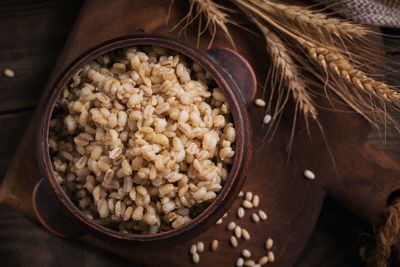 Bowl of cooked peeled barley grains porridge