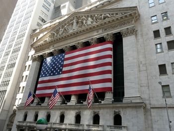 Low angle view of flag against building