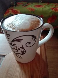 Close-up of coffee cup on table