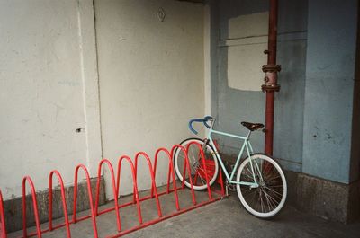 Bicycle leaning against wall