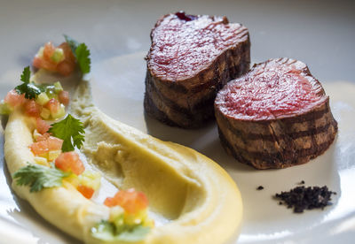 Close-up of veal medallion served in plate