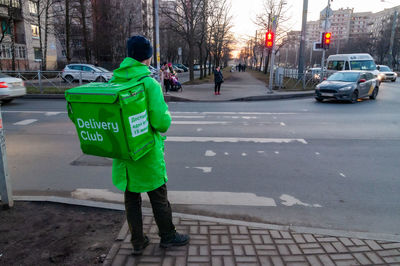 Rear view of two people on street