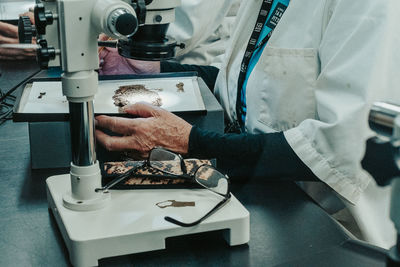 Lab technician analysing dinosaur bone