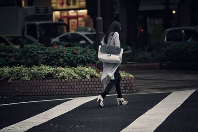 Woman with umbrella on street