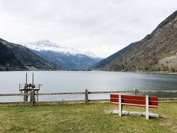 Scenic view of lake and mountains against sky