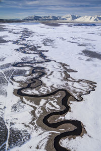 Hot creek winds its way through a california winter landscape