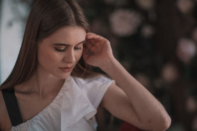 Portrait of a young woman looking down