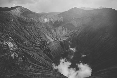 High angle view of mountain against cloudy sky