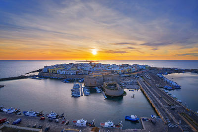 High angle view of sea against sky during sunset