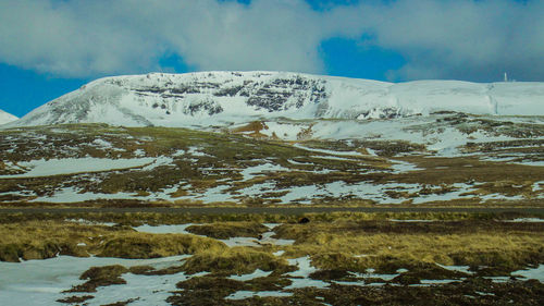 Scenic view of snowcapped mountain against sky