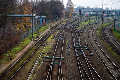 Railway tracks and switches for train traffic near the railway station, perspective top view