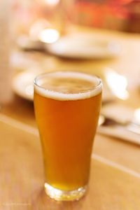 Close-up of beer glass on table