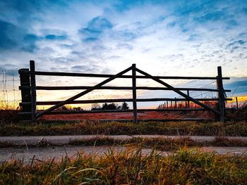 Bridge over field against sky