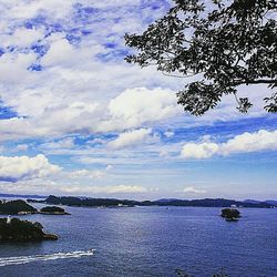 View of calm sea against cloudy sky