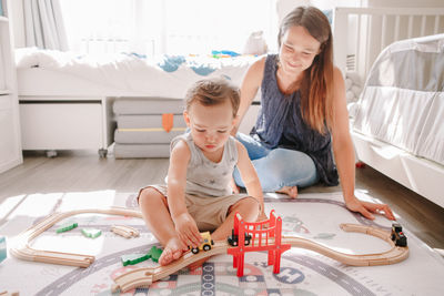 Mother and son playing with toy