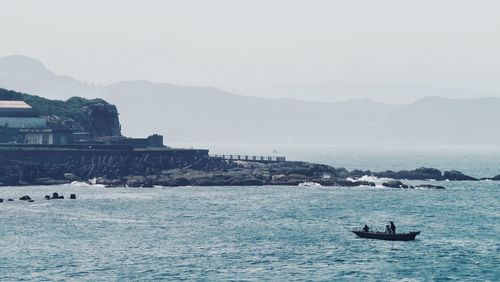 Boats sailing in sea