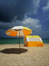 Umbrella and canopy on beach