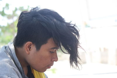 Portrait of young man looking away