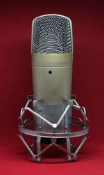 Close-up of microphone against red background