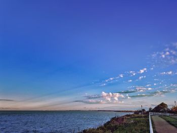 Scenic view of sea against blue sky