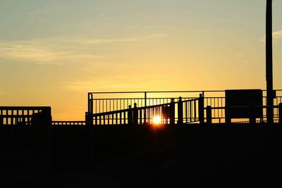 Silhouette of built structure at sunset