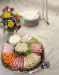 High angle view of vegetables in plate on table