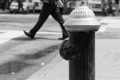 Close-up of fire hydrant on sidewalk