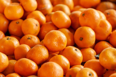 Full frame shot of oranges at market stall