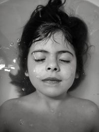 Portrait of shirtless boy in bathroom