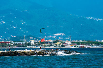 Aerial view of sea and buildings in city