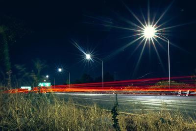 Light trails against sky at night