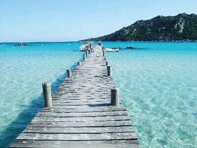 water, sea, the way forward, tranquil scene, tranquility, pier, blue, scenics, wood - material, jetty, boardwalk, beauty in nature, beach, horizon over water, nature, clear sky, sky, idyllic, diminishing perspective, narrow