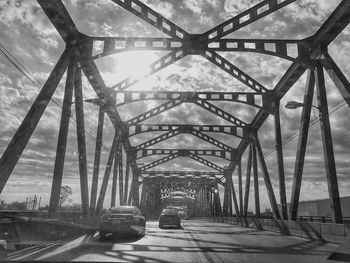 Bridge in city against sky