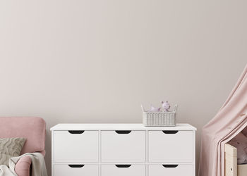 Empty cream wall in modern child room. mock up interior in scandinavian style. copy space