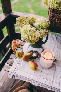 High angle view of drinks with fruit on table