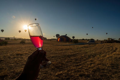 Champagne for celebration after ballooning. beautiful colorful hot air balloons at cappadocia