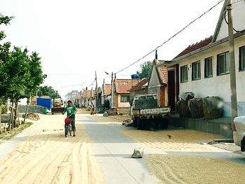 Man riding bicycle on road