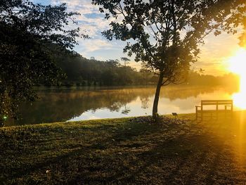 Scenic view of lake against sky during sunset