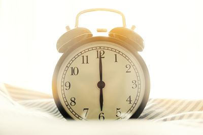 Close-up of clock on table