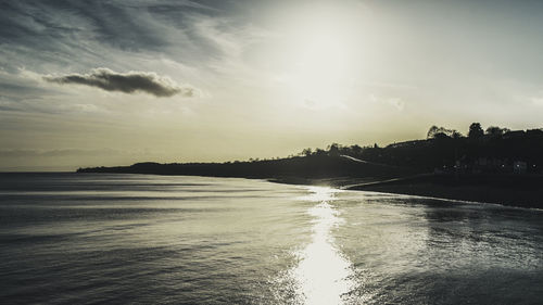 Scenic view of beach against sky during sunset