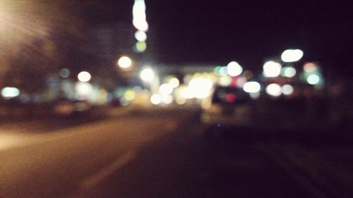 Defocused image of illuminated street lights at night