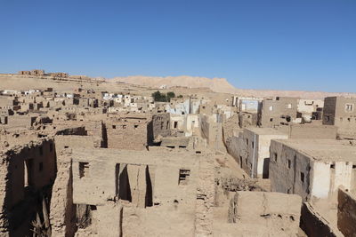 Panoramic view of old building against clear blue sky