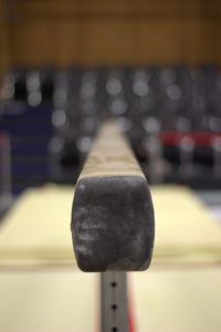 Close-up of light bulb on table against wall